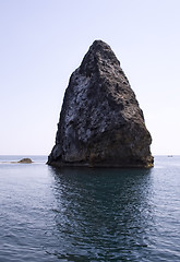 Image showing Rocks and endless sea with clear blue sky