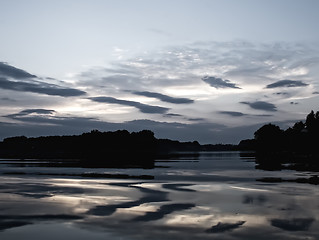 Image showing Romantic sunset on the lake with fog