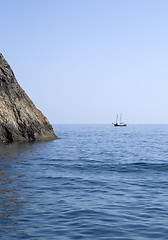 Image showing Ship and several boats going into the sea.