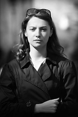 Image showing Young woman among human rush in the city