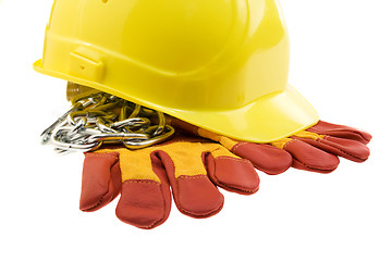 Image showing Yellow hard hat, protective gloves and steel chain isolated