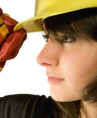 Image showing Girl in yellow hard hat and red gloves