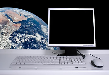 Image showing PC with earth background and black desktop