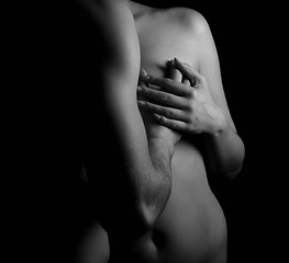 Image showing Hands hugging a girl in passion