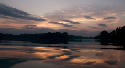 Image showing Romantic sunset on the lake with fog