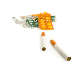 Image showing Cigarettes and pills isolated.Illnesses from cigarettes concept