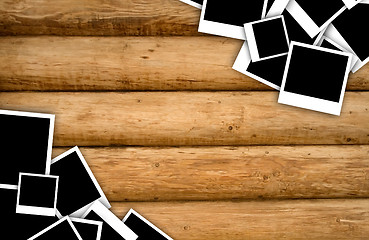 Image showing Empty instant photos on grunge wood background