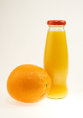 Image showing Orange juice bottle with orange fruit. The file includes clippin