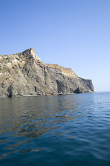 Image showing Mountain on a rocky coastline.View from sea.