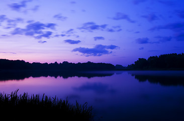 Image showing Romantic sunset on the lake with fog