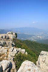 Image showing Top of the mountain with green forest above