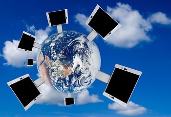 Image showing Blank billboards on the earth with blue sky background