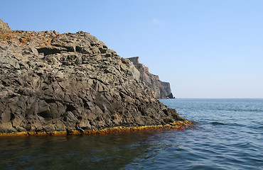 Image showing Mountain on a rocky coastline.View from sea.