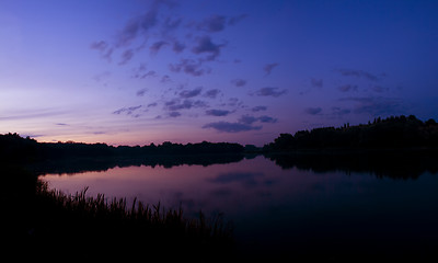 Image showing Romantic sunset on the lake with fog