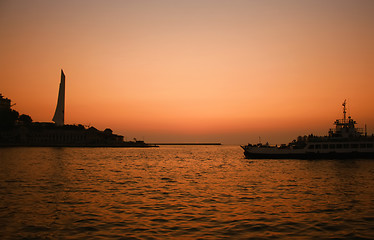 Image showing Sunset sea with boat crossing the bay