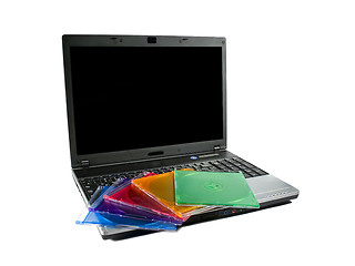 Image showing Colored cd`s on a laptop