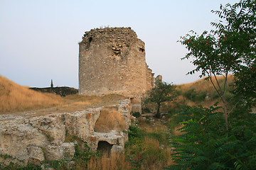 Image showing Ancient ruins of brick tower during sunset.