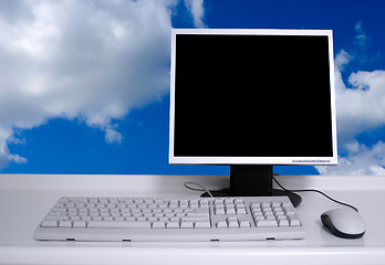 Image showing PC with black desktop and sky background