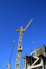 Image showing Construction site with yellow crane