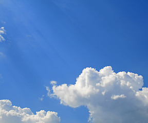 Image showing Sunny clouds with rays of light