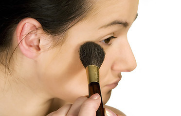 Image showing Sexy girl putting make-up