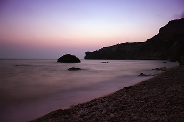 Image showing Sunset sea rocky beach