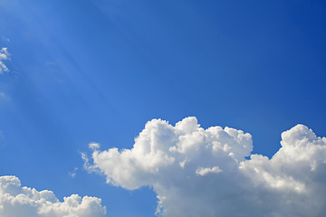 Image showing Sunny clouds with rays of light