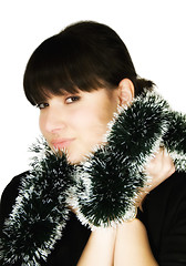 Image showing Young woman with green garland