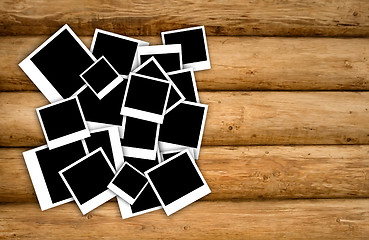 Image showing Empty instant photos on grunge wood background