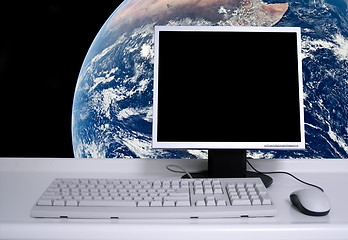 Image showing PC with earth background and black desktop