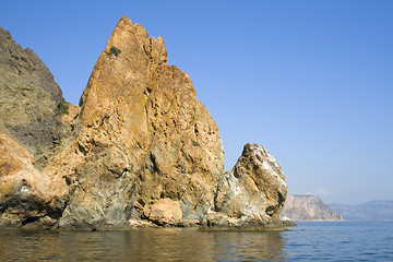 Image showing Mountain on a rocky coastline.View from sea.