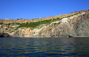 Image showing Mountain on a rocky coastline.View from sea.