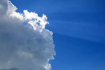 Image showing Sunny clouds with rays of light