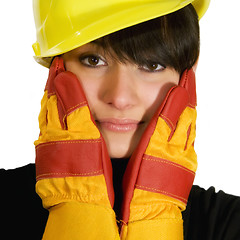 Image showing Girl in yellow hard hat and red gloves