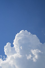 Image showing Puffy clouds on blue sky