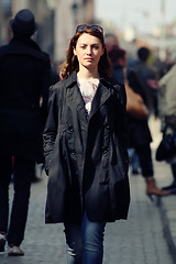 Image showing Young woman among human rush in the city