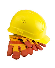 Image showing Yellow hard hat, protective gloves and steel isolated