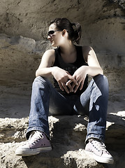 Image showing Model sitting on the rocks. Urban style