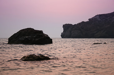 Image showing Sunset sea rocky beach