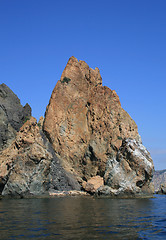 Image showing Mountain on a rocky coastline.View from sea.