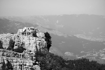 Image showing Top of the mountain with green forest above