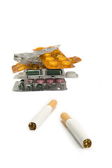 Image showing Cigarettes and pills isolated.Illnesses from cigarettes concept