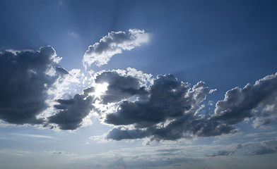 Image showing Sunny clouds with rays of light