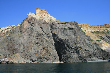 Image showing Mountain on a rocky coastline.View from sea.