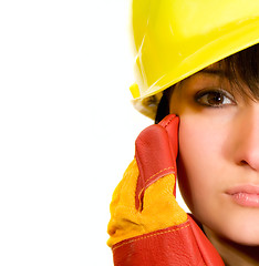 Image showing Girl in yellow hard hat and red gloves