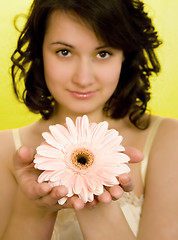 Image showing Smelling a spring flower