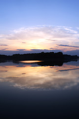 Image showing Romantic sunset on the lake with fog