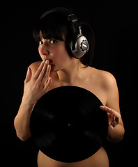 Image showing Naked girl with vinyl plate and headphones