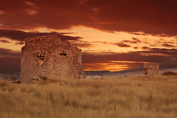 Image showing Ancient ruins of brick tower during sunset.