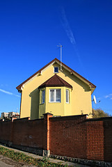 Image showing Yellow house among blue sky